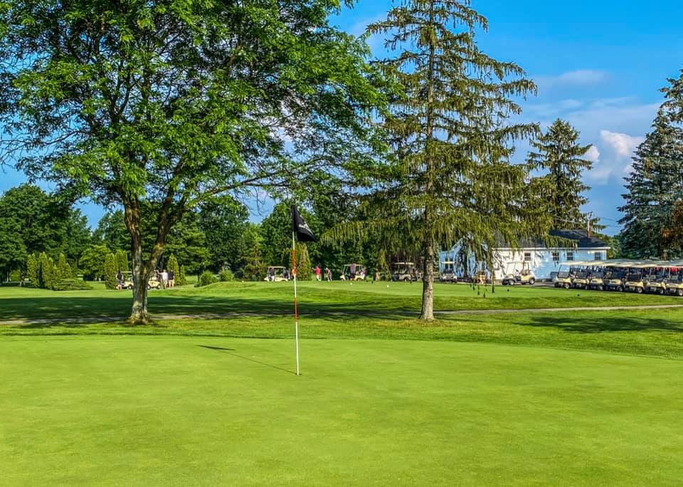 Golf course hole with trees