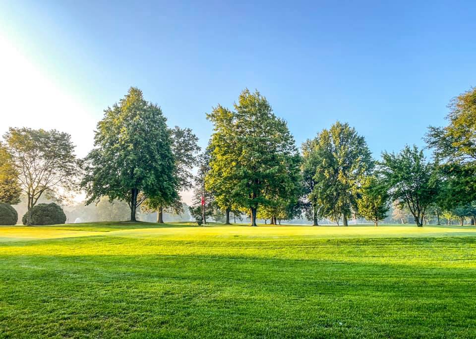 View of golf course with sunlight